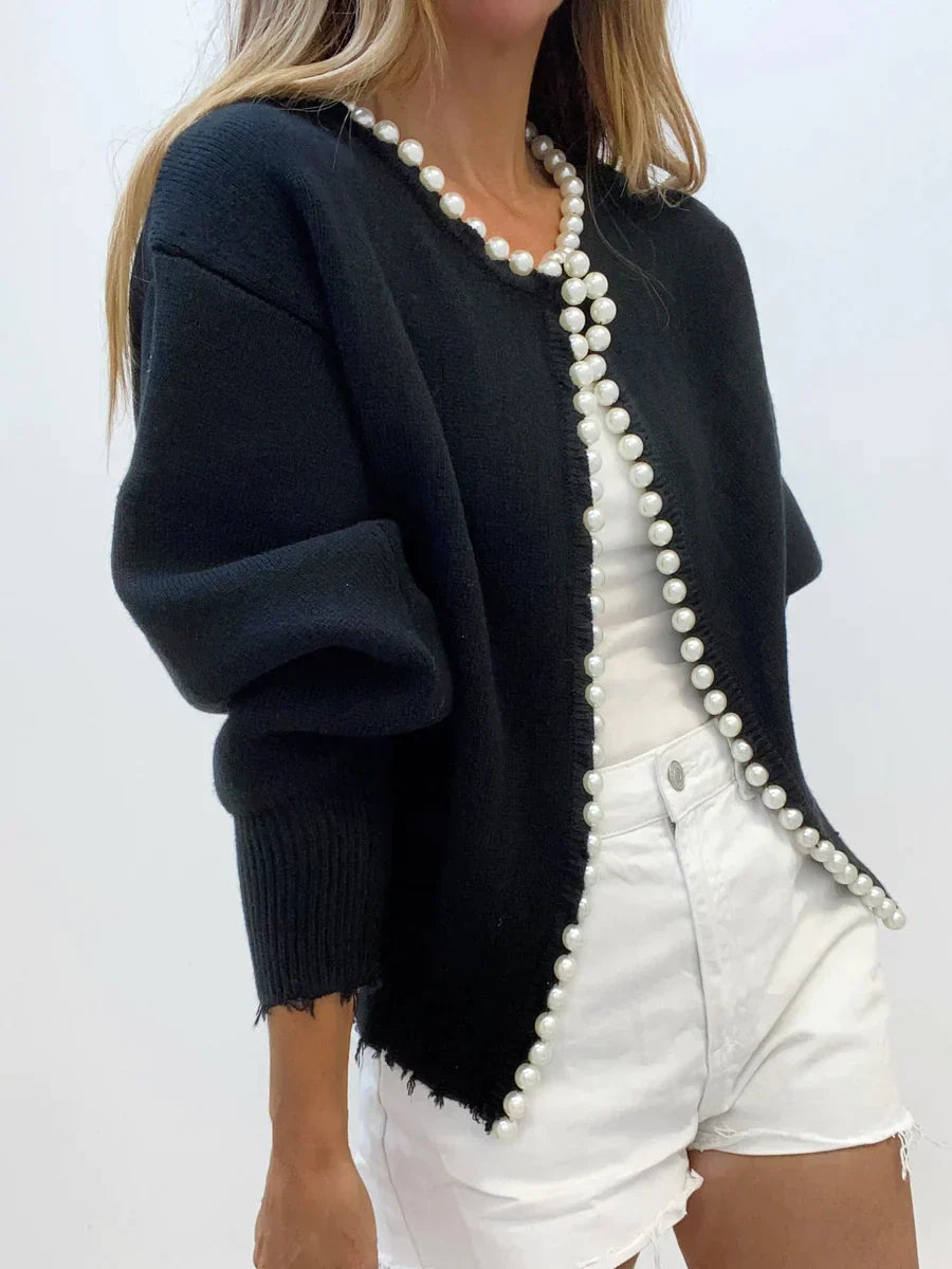 Robe élégante avec perles et ourlet côtelé