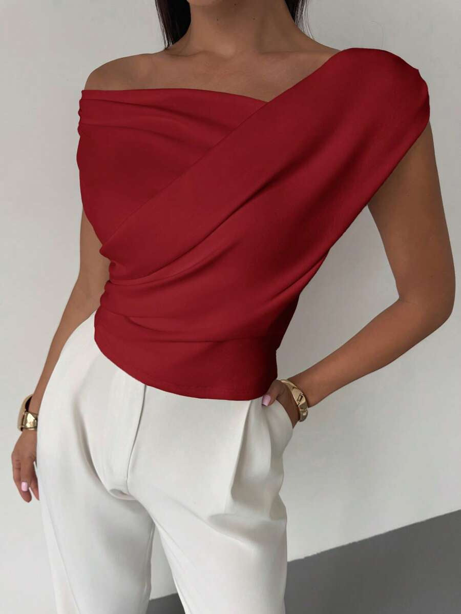Haut féminin élégant coupe asymétrique