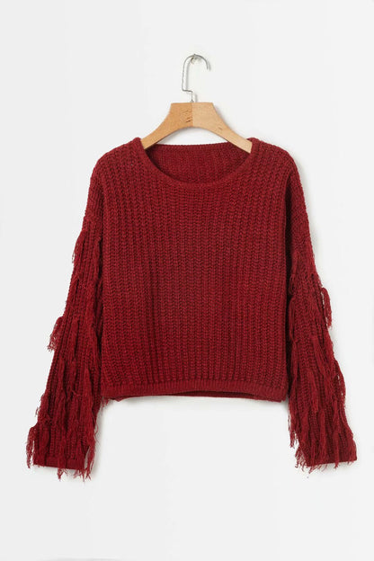 Pull femme mode tricot torsadé manches à franges