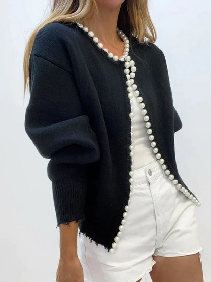 Robe élégante avec perles et ourlet côtelé