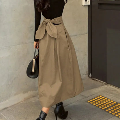 Jupe midi élégante taille haute avec nœud
