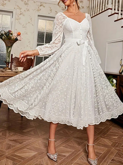 Robe élégante pour femme en dentelle, à manches bouffantes et taille cintrée