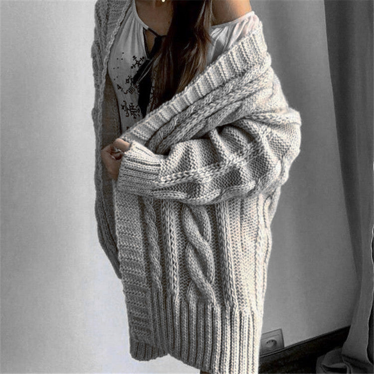 Robe en laine grande taille à motif torsadé et col en V