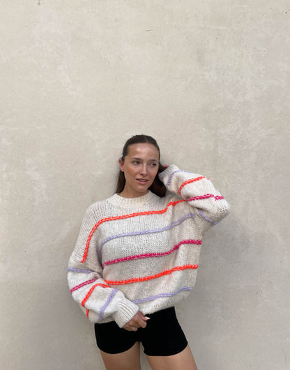 Gros pull oversize surpiqûres néon