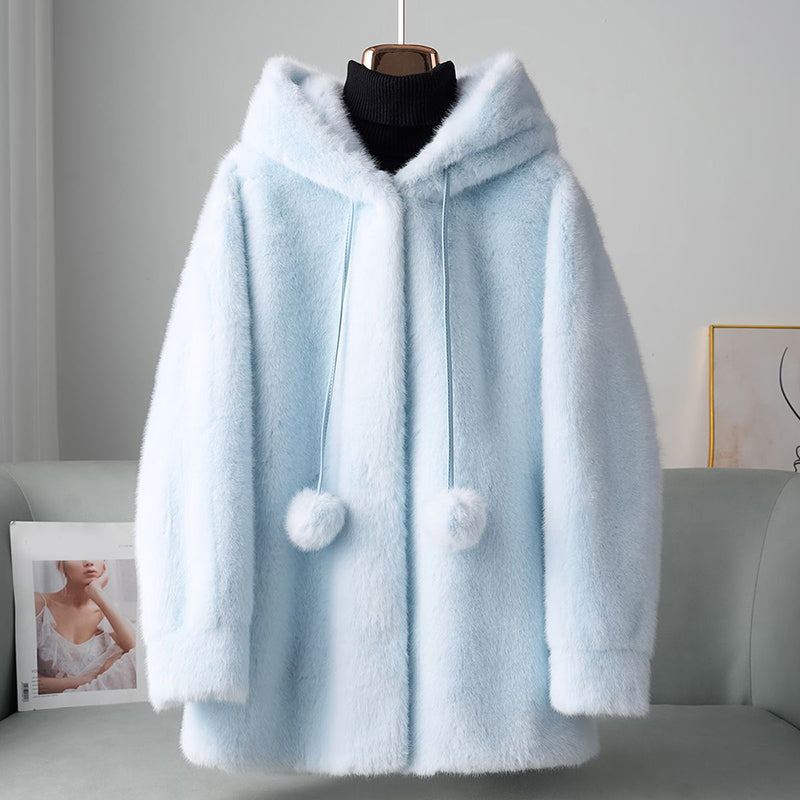 Veste chic en fausse fourrure avec détails pompon