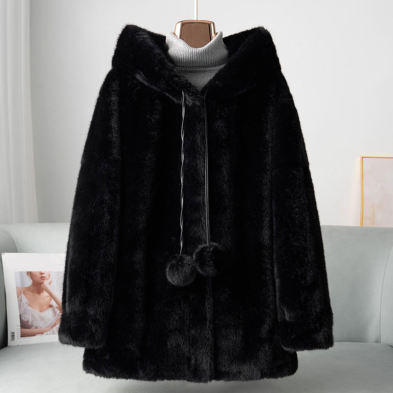 Veste chic en fausse fourrure avec détails pompon