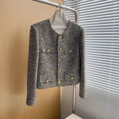 Veste féminine élégante avec de nombreuses poches style tweed