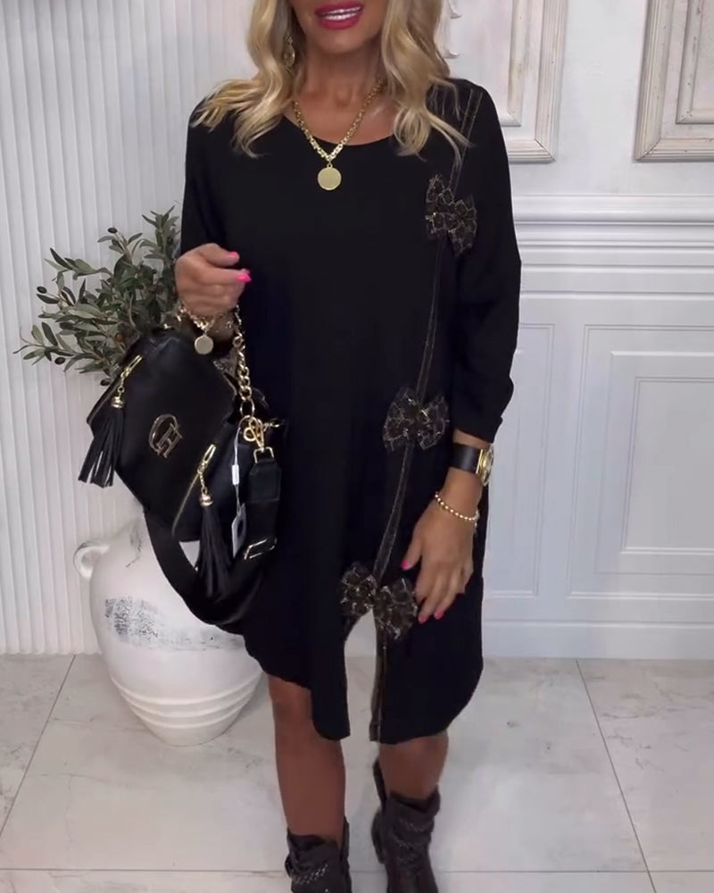 Robe unie élégante avec détail de nœud