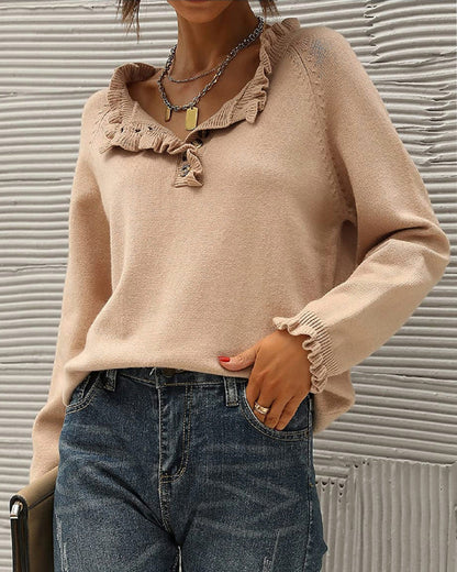 Pull uni élégant avec détail volanté